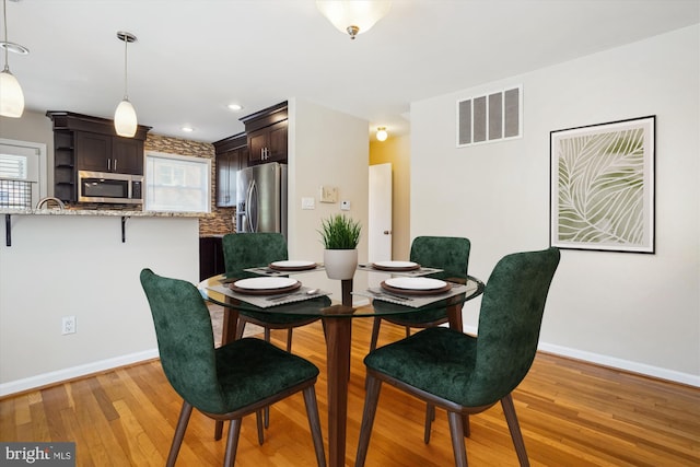 5100 12th St NE, Washington, DC 20011 - dining room featuring light wood-type flooring and recessed lighting