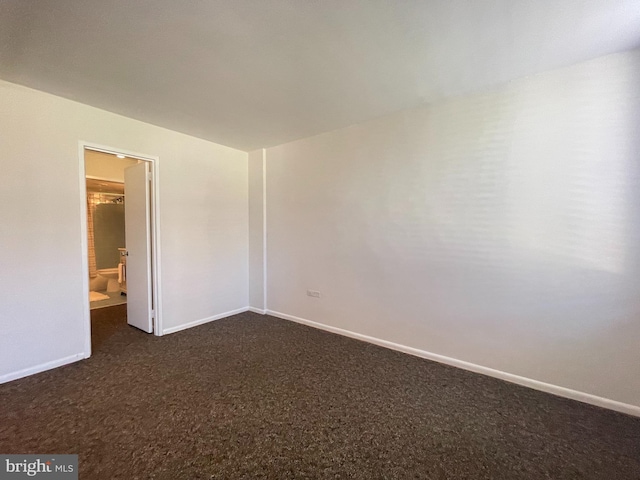 2939 Van Ness St NW Unit 743, Washington, DC 20008 - spare room featuring dark colored carpet and baseboards