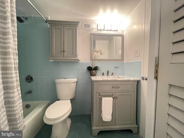 2939 Van Ness St NW Unit 743, Washington, DC 20008 - full bathroom with tile walls, vanity, tile patterned flooring, shower / bathtub combination with curtain, and a wainscoted wall