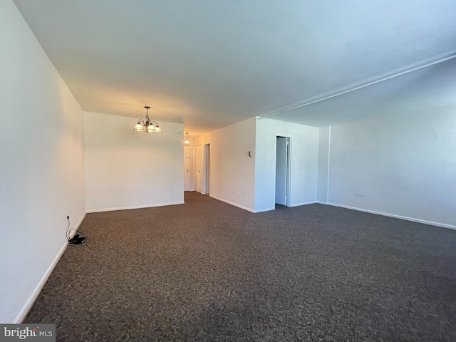 2939 Van Ness St NW Unit 743, Washington, DC 20008 - unfurnished room featuring a chandelier and dark colored carpet
