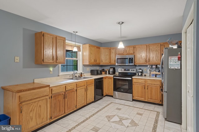 716 Euclid Ave, Lancaster, PA 17603 - kitchen featuring stainless steel appliances, light tile patterned floors, hanging light fixtures, and light countertops