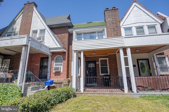 7127 Woolston Ave, Philadelphia, PA 19138 - view of front of house featuring a chimney, covered porch, and brick siding