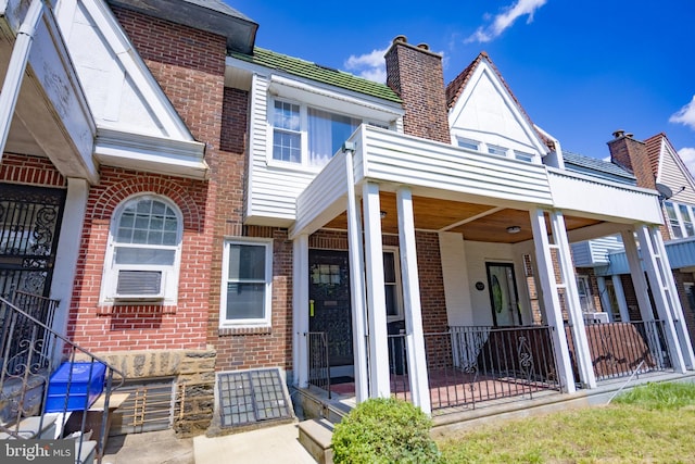 7127 Woolston Ave, Philadelphia, PA 19138 - view of front of house featuring brick siding, a chimney, and cooling unit