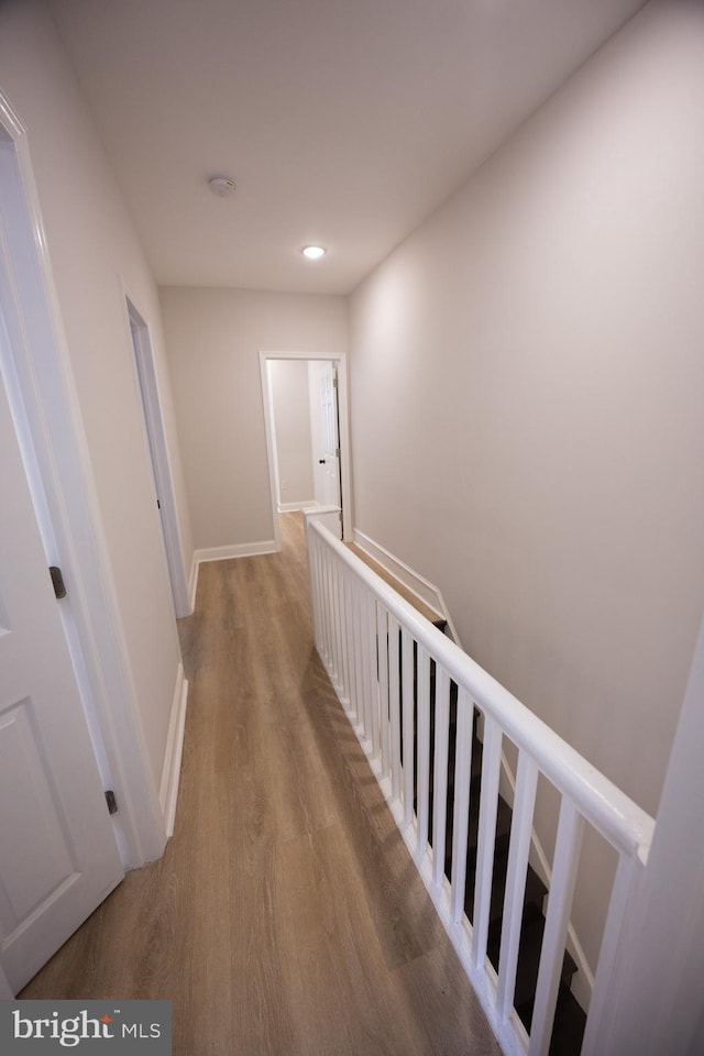 7127 Woolston Ave, Philadelphia, PA 19138 - corridor with an upstairs landing and wood finished floors
