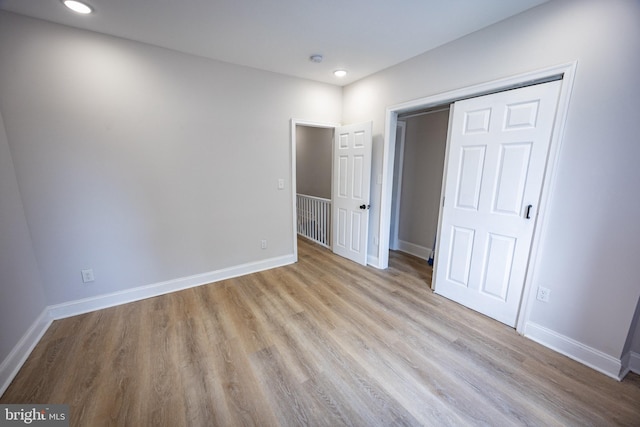 7127 Woolston Ave, Philadelphia, PA 19138 - unfurnished bedroom with wood finished floors, a closet, and recessed lighting