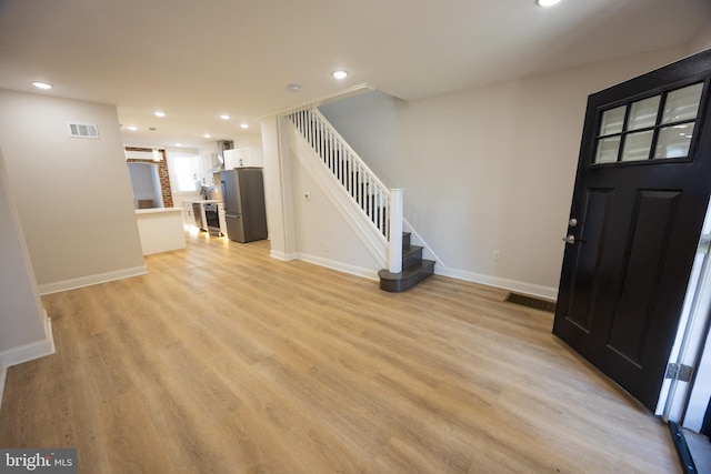 7127 Woolston Ave, Philadelphia, PA 19138 - foyer entrance featuring stairway, light wood-style floors, and recessed lighting