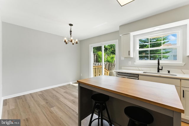 3159 Benton Square Dr, Olney, MD 20832 - kitchen featuring wooden counters, light wood finished floors, a chandelier, and white cabinetry