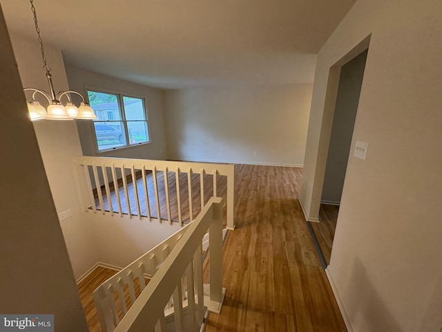 16 Carissa Ct, Owings Mills, MD 21117 - corridor with wood finished floors, an upstairs landing, and a chandelier