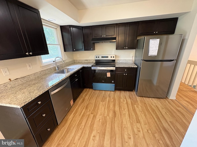 16 Carissa Ct, Owings Mills, MD 21117 - kitchen with stainless steel appliances, light wood-style floors, under cabinet range hood, and light stone countertops