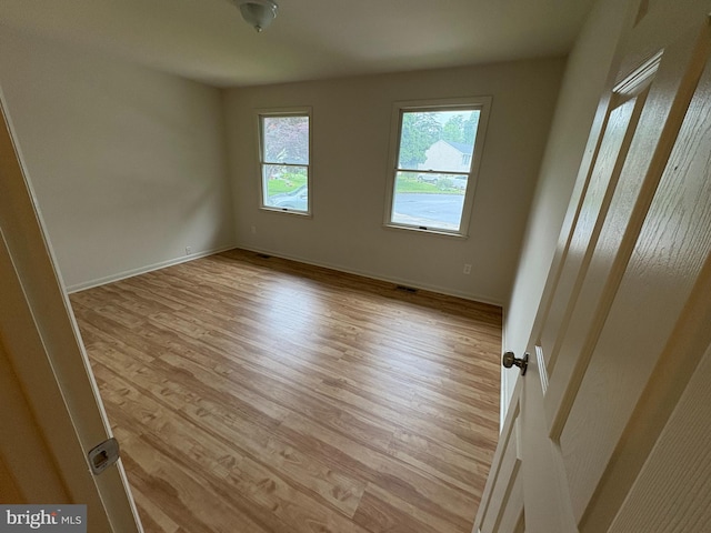 16 Carissa Ct, Owings Mills, MD 21117 - unfurnished room with light wood finished floors and baseboards