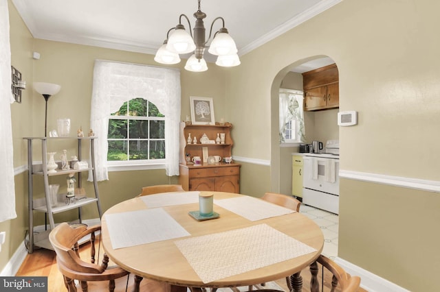 5947 Lillyan Ave, Baltimore, MD 21206 - dining room with a chandelier, arched walkways, and crown molding