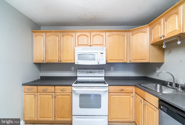 307 Yoakum Pkwy Unit 716, Alexandria, VA 22304 - kitchen with white appliances, light brown cabinets, dark countertops, and a textured ceiling