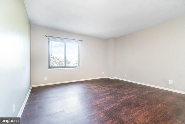 307 Yoakum Pkwy Unit 716, Alexandria, VA 22304 - empty room with dark wood-style flooring and baseboards