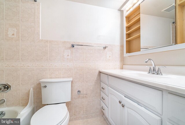 307 Yoakum Pkwy Unit 716, Alexandria, VA 22304 - full bathroom with vanity, tile walls, and tile patterned floors