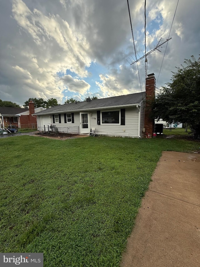 7526 Albemarle Dr, Manassas, VA 20111 - ranch-style home with a front yard, a chimney, and a garage