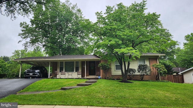 12912 Middlevale Ln, Silver Spring, MD 20906 - ranch-style house with driveway, an attached carport, brick siding, and a porch