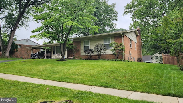 12912 Middlevale Ln, Silver Spring, MD 20906 - ranch-style home with a chimney, an attached carport, and brick siding