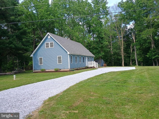 10705 Millbrook Dr, Chestertown, MD 21620 - view of property exterior with gravel driveway, a yard, crawl space, and a shingled roof