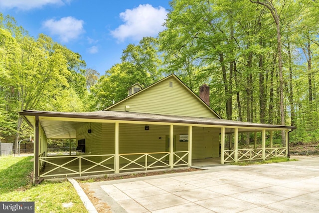 11944 Andrew St, Silver Spring, MD 20902 - view of front of house with a chimney, a porch, and roof with shingles