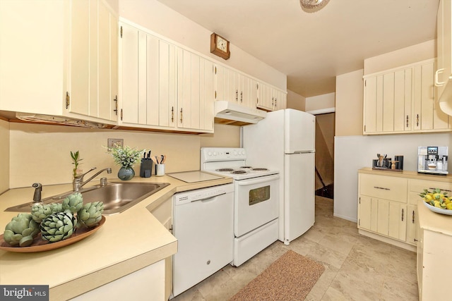 11944 Andrew St, Silver Spring, MD 20902 - kitchen featuring under cabinet range hood, white appliances, and light countertops