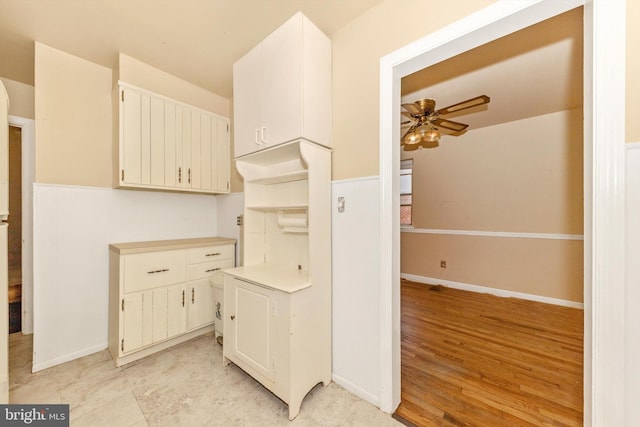 11944 Andrew St, Silver Spring, MD 20902 - kitchen with ceiling fan, light countertops, and light wood-type flooring