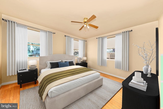 11944 Andrew St, Silver Spring, MD 20902 - bedroom with multiple windows, wood-type flooring, and ceiling fan