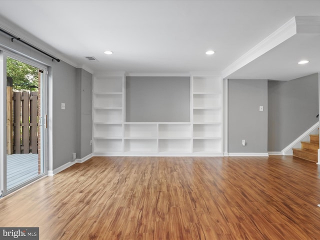 3390 Whipple Ct, Annandale, VA 22003 - empty room featuring wood finished floors, stairway, recessed lighting, built in features, and crown molding