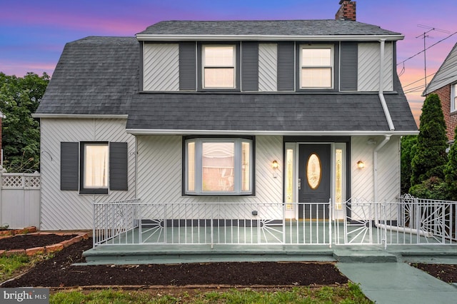 1112 Serrill Ave, Lansdowne, PA 19050 - view of front of property featuring a chimney and roof with shingles