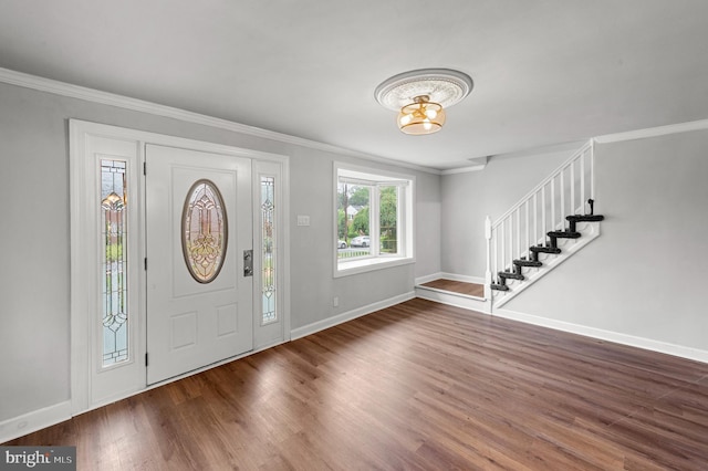 1112 Serrill Ave, Lansdowne, PA 19050 - entrance foyer featuring stairway, wood finished floors, ornamental molding, and a chandelier