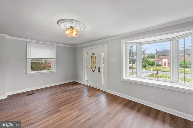 1112 Serrill Ave, Lansdowne, PA 19050 - foyer featuring plenty of natural light, ornamental molding, and wood finished floors