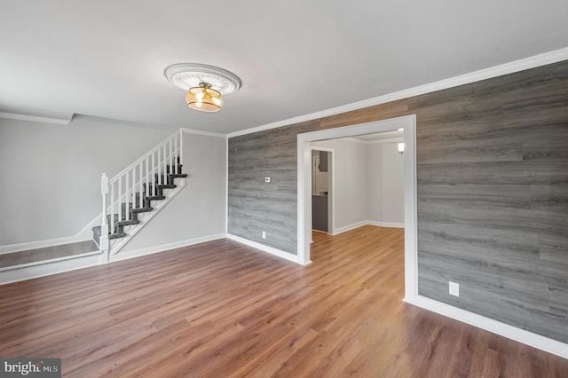1112 Serrill Ave, Lansdowne, PA 19050 - empty room with crown molding, stairs, and wood finished floors