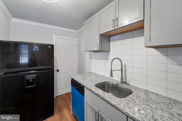1112 Serrill Ave, Lansdowne, PA 19050 - kitchen featuring black refrigerator with ice dispenser, dishwasher, crown molding, wood finished floors, and tasteful backsplash