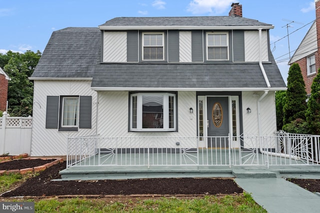 1112 Serrill Ave, Lansdowne, PA 19050 - view of front of property featuring a shingled roof and a chimney
