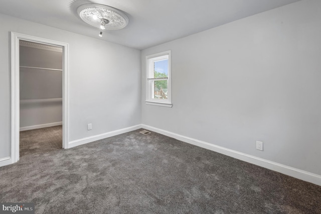 1112 Serrill Ave, Lansdowne, PA 19050 - unfurnished bedroom with carpet flooring, a spacious closet, and a closet