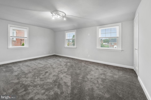 1112 Serrill Ave, Lansdowne, PA 19050 - unfurnished room featuring dark colored carpet and lofted ceiling