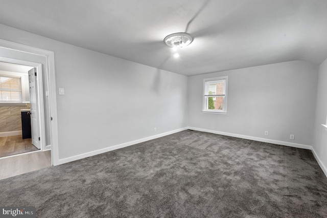 1112 Serrill Ave, Lansdowne, PA 19050 - empty room with dark carpet and lofted ceiling