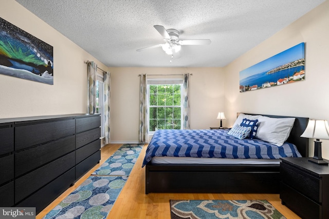 1533 Lincoln Way Unit 301A, Mclean, VA 22102 - bedroom featuring wood finished floors, a textured ceiling, and a ceiling fan