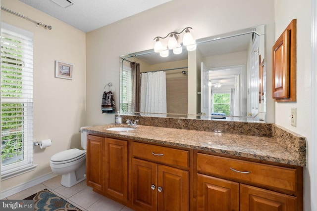1533 Lincoln Way Unit 301A, Mclean, VA 22102 - bathroom with vanity, tile patterned floors, plenty of natural light, and a shower with shower curtain