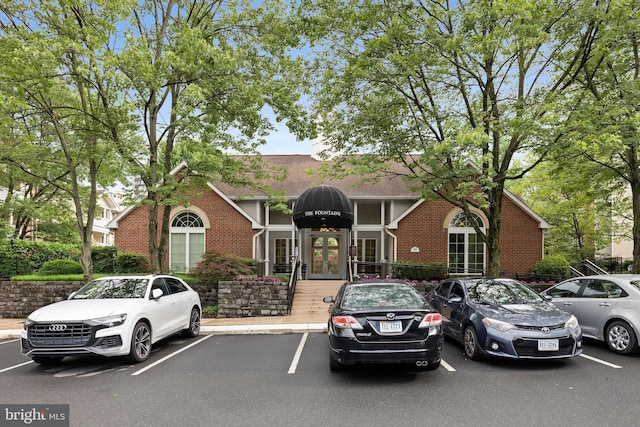 1533 Lincoln Way Unit 301A, Mclean, VA 22102 - view of front of home with french doors, uncovered parking, and brick siding