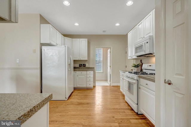 13854 Cinch Ln, Gainesville, VA 20155 - kitchen with white appliances, white cabinetry, light wood finished floors, recessed lighting, and light countertops