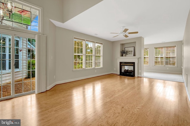 13854 Cinch Ln, Gainesville, VA 20155 - unfurnished living room with plenty of natural light, a ceiling fan, and wood finished floors