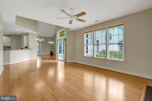 13854 Cinch Ln, Gainesville, VA 20155 - unfurnished living room with a chandelier, a ceiling fan, and wood finished floors