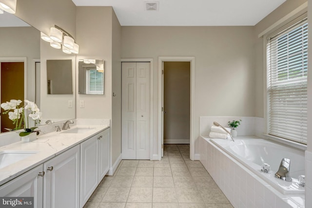13854 Cinch Ln, Gainesville, VA 20155 - bathroom featuring double vanity, a bath, tile patterned flooring, and a closet