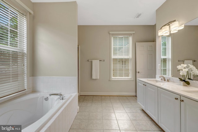 13854 Cinch Ln, Gainesville, VA 20155 - bathroom featuring a garden tub, double vanity, plenty of natural light, and tile patterned flooring