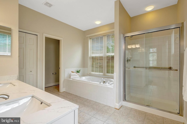 13854 Cinch Ln, Gainesville, VA 20155 - full bathroom featuring a bath, a stall shower, double vanity, and tile patterned flooring