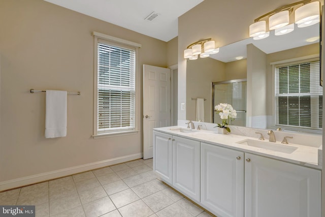13854 Cinch Ln, Gainesville, VA 20155 - full bath with double vanity, tile patterned flooring, and a shower stall