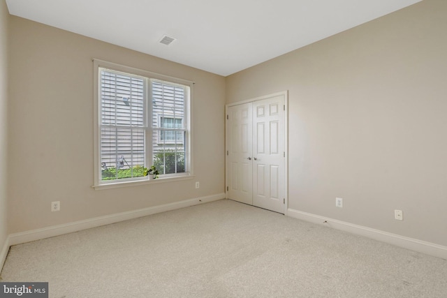 13854 Cinch Ln, Gainesville, VA 20155 - unfurnished bedroom with carpet floors, multiple windows, and a closet