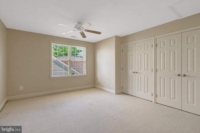 13854 Cinch Ln, Gainesville, VA 20155 - unfurnished bedroom with multiple closets, carpet floors, attic access, and a ceiling fan