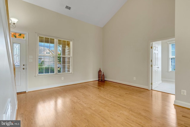 13854 Cinch Ln, Gainesville, VA 20155 - spare room with wood finished floors and high vaulted ceiling