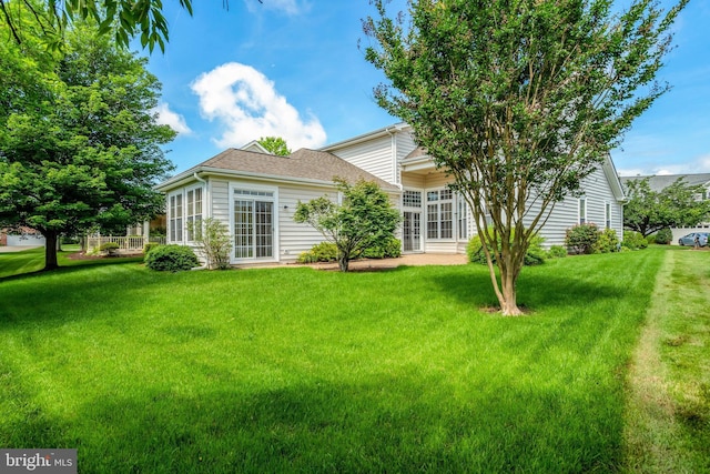 13854 Cinch Ln, Gainesville, VA 20155 - rear view of house featuring a yard and a shingled roof